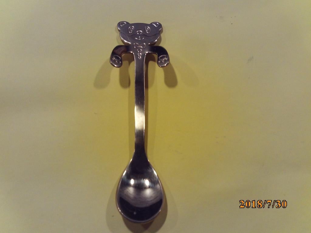 verguld lepeltje met beertje hoofd en hangende pootjes, Ophalen of Verzenden, Gebruikt, Rvs of Chroom