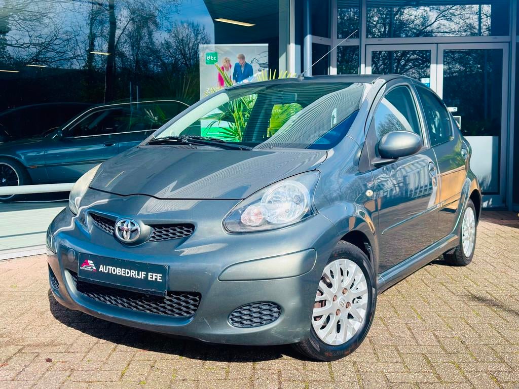 Toyota Aygo 1.0-12V Aspiration Green Leer*Airco*Sprtvlgn*Str, Auto's, Toyota, Voorwielaandrijving, Gebruikt, Zwart, 4 stoelen