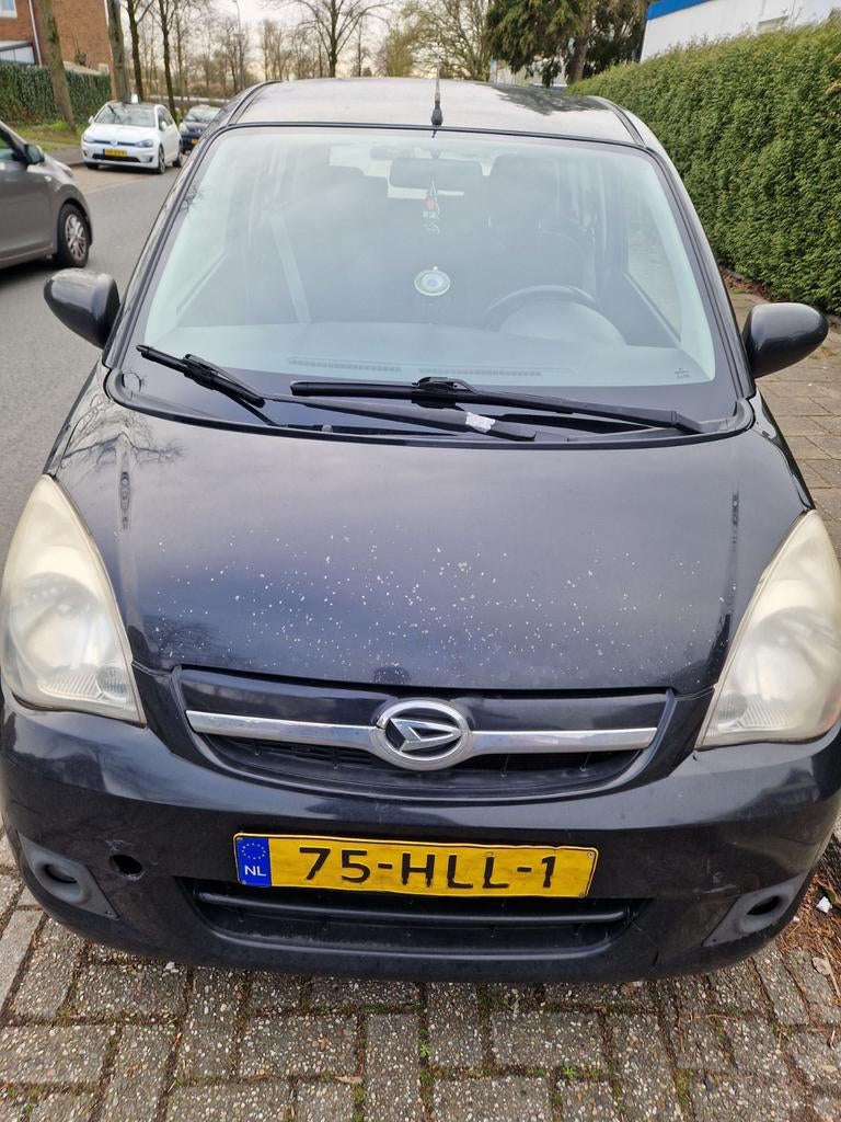 Daihatsu Cuore 1.0 5D 2009 Zwart, Auto's, Daihatsu, Voorwielaandrijving, Stof, 600 kg, Zwart