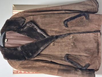 Zo goed als nieuw mooie warme winter jas maat 42 beschikbaar voor biedingen