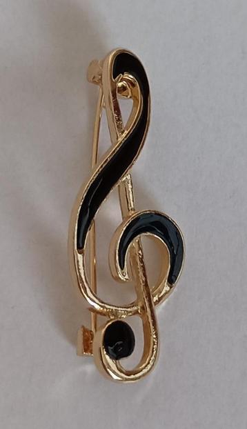 Muzieksleutel broche beschikbaar voor biedingen