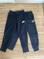 2 zwarte Joggingbroeken 122-128: Nike & America Today, Broek, Gebruikt, Jongen of Meisje, Ophalen of Verzenden