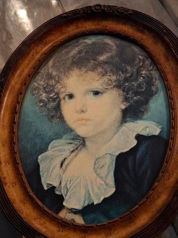 Oude prent van kind in ovale lijst beschikbaar voor biedingen