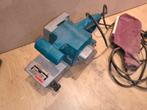 Makita 9924b bandschuurmachine, Doe-het-zelf en Verbouw, Gereedschap | Schuurmachines, Ophalen of Verzenden, Gebruikt, 1200 watt of meer