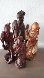Collectie beelden (4) in fraai houtsnijwerk uit Azië, Verzenden