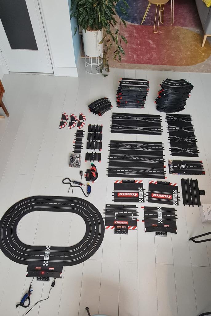 Carrera 124 132 evolution baandelen met veel extras, Kinderen en Baby's, Speelgoed | Racebanen, Gebruikt, Racebaan, Elektrisch
