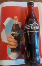 Oud gevuld coca cola flesje met dop, Ophalen of Verzenden, Huis en Inrichting