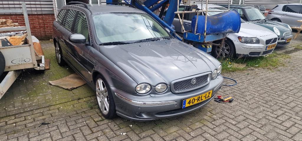 Jaguar X-Type 2.5 V6 Estate Executive 4WD AUT 2004 Grijs, Auto's, Jaguar, Automaat, 196 pk, Beige, 2495 cc