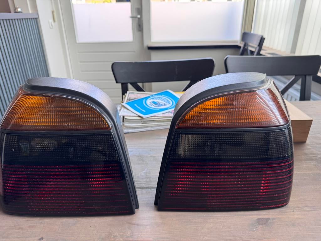 VW Golf 3 achterlichten smoke origineel Hella., Auto-onderdelen, Verlichting, Ophalen of Verzenden