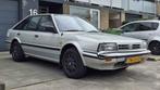Nissan Bluebird 2.0 HB AUT 1988 Grijs met (blik)schade, Stof, Overige modellen, 4 cilinders, 1200 kg