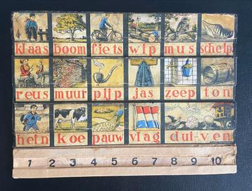 Oude leesplank met afbeeldingen van Andre Vlaanderen beschikbaar voor biedingen