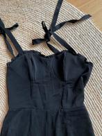 Zwarte jumpsuit met strikjes - Maat M - nieuw en ongedragen, Ophalen, Zo goed als nieuw, Maat 38/40 (M), Zwart