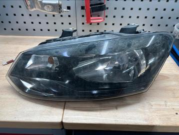 VW Polo koplamp links met zwarte binnenkant  beschikbaar voor biedingen