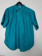 Blouse de stof is zijdeglans en de kleur is turquoise., Verzenden, Zo goed als nieuw, Maat 38/40 (M), Overige kleuren