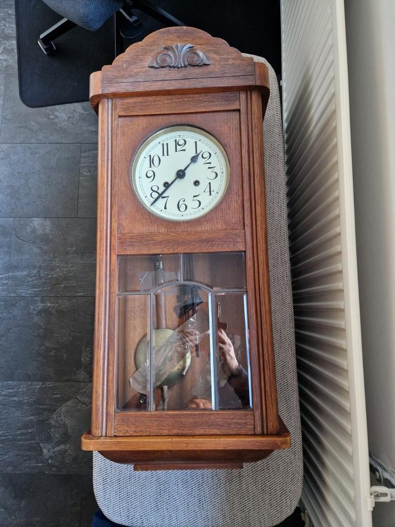 Antieke hangklok met klepel, Ophalen