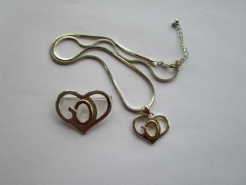 Ketting + broche met tekst GOD beschikbaar voor biedingen