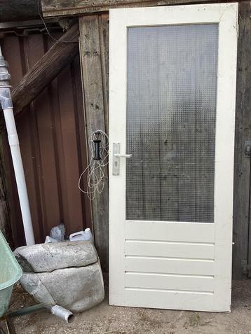 Nettehardhouten buitendeur met draadglas beschikbaar voor biedingen