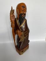 Houtsnijwerk / houten beeld. Aziatische lachende man., Ophalen
