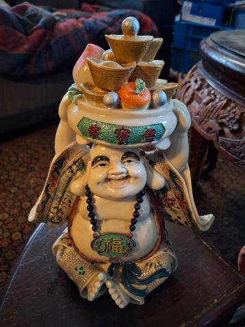 Boeddhabeeld met gelukssymbolen beschikbaar voor biedingen