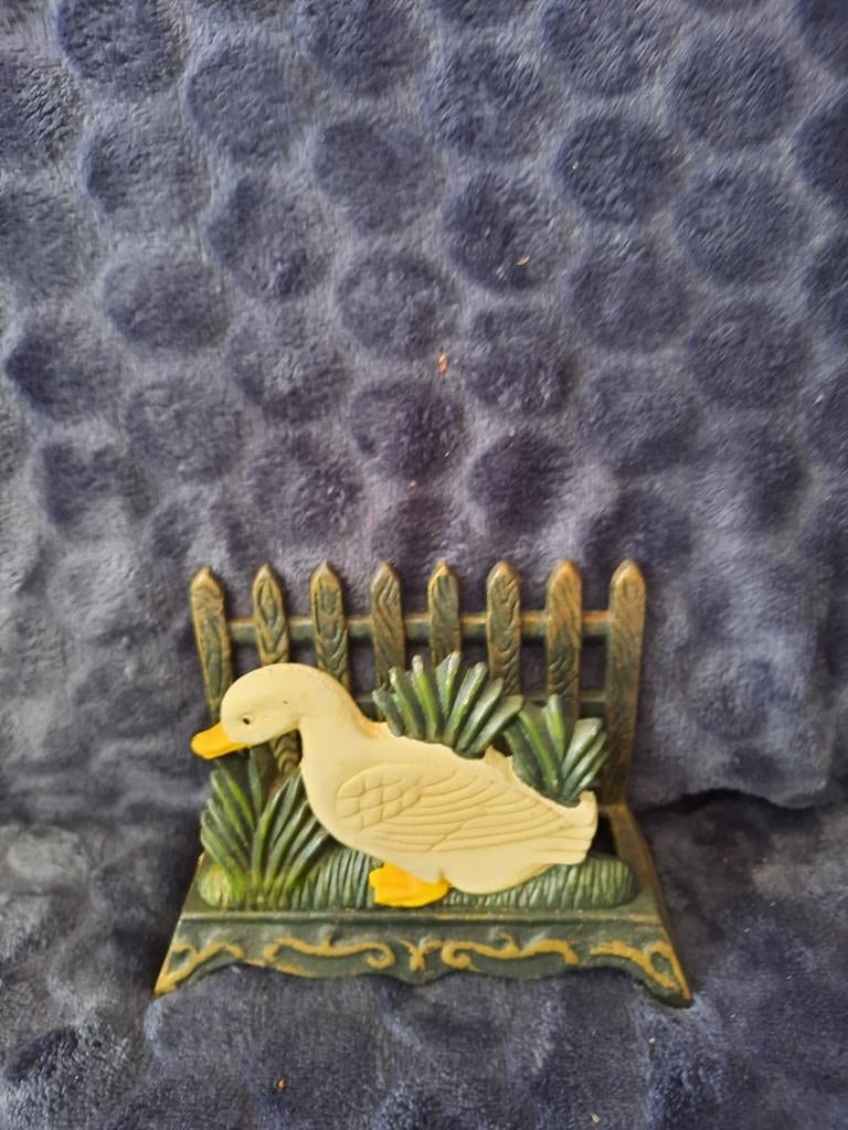 Gietijzeren servethouder., Ophalen