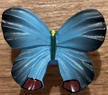 Knop Vlinder gekleurd beschikbaar voor biedingen