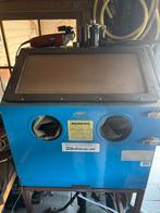 Straalkast met glasparels en grit, Ophalen