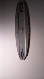 Klok grijs ovaal doet het goed, Ophalen