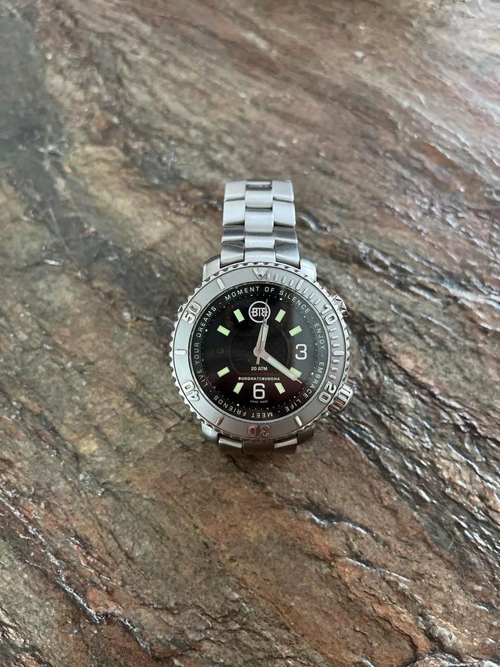 Buddha to buddha horloge, Sieraden, Tassen en Uiterlijk, Horloges | Heren, Zo goed als nieuw, Polshorloge, Overige merken, Staal