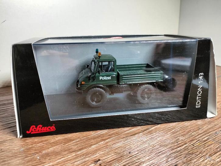 Te koop Schuco Mercedes-Benz Unimog 406 Polizei limited., Hobby en Vrije tijd, Modelauto's | 1:43, Zo goed als nieuw, Bus of Vrachtwagen