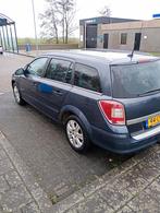 Opel Astra 1.6 16V 85KW St.wgn. 2010 Blauw, Auto's, Voorwielaandrijving, 15 km/l, Zwart, Blauw