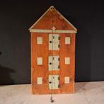 Decoratief houten pakhuis, Ophalen
