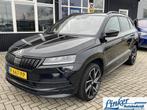 Skoda Karoq 1.5 TSI ACT Sportline Business - NL-AUTO TREKHAA, Auto's, Skoda, Stof, 4 cilinders, Zwart, Bedrijf