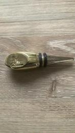 Flessenstop van Joseph Guy, Ophalen