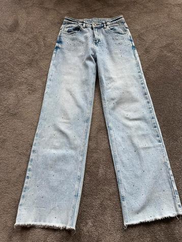 Spijkerbroek lichtblauw met strass steentjes mt 158 beschikbaar voor biedingen