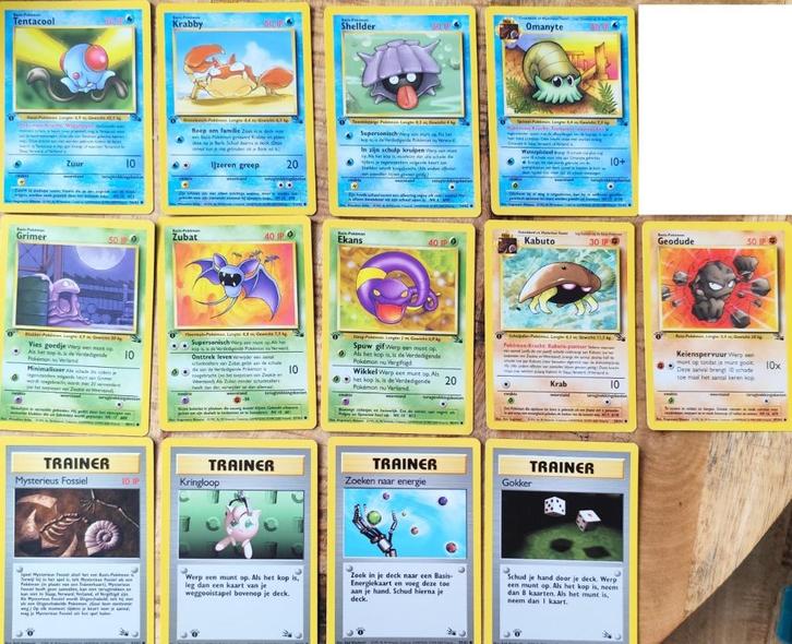 Set van 13 Nederlandse Fossil 1e editie Pokemonkaarten, Hobby en Vrije tijd, Verzamelkaartspellen | Pokémon, Nieuw, Meerdere kaarten