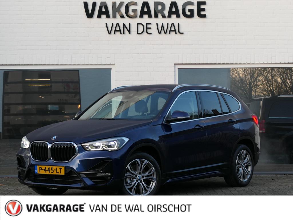 BMW X1 sDrive18i High Executive | Orange edition | Trekhaak, Auto's, BMW, Gebruikt, Euro 6, Blauw, 19 km/l