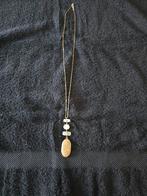 Te koop lange goudkleurige halsketting met hanger., Ophalen of Verzenden, Zo goed als nieuw, Goud, Overige materialen
