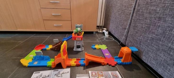 Toet toet auto Super stuntpark z.g.a.n., Kinderen en Baby's, Speelgoed | Vtech, Zo goed als nieuw, Ophalen of Verzenden