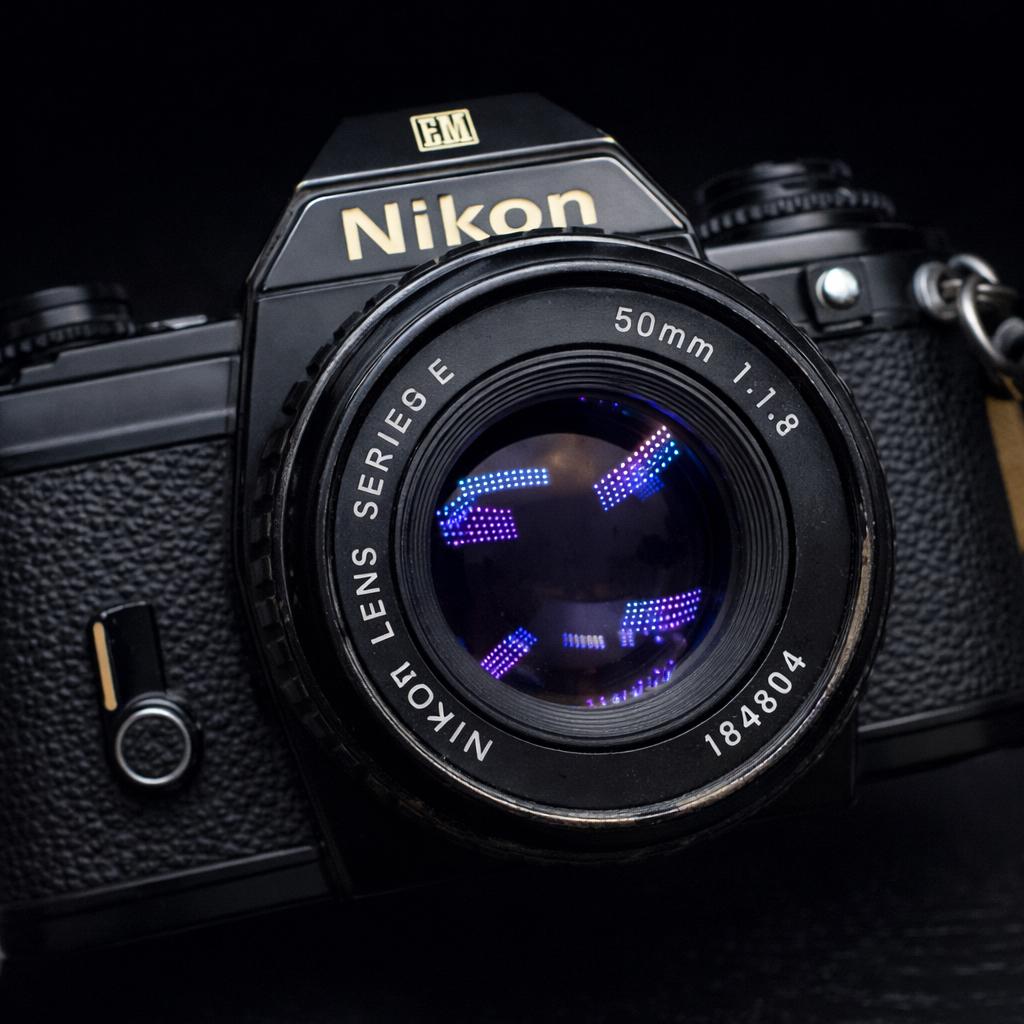 Nikon EM + 50mm f/1.8 lens – vintage camera – met tas, Audio, Tv en Foto, Fotocamera's Analoog, Gebruikt, Spiegelreflex, Ophalen of Verzenden