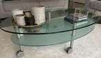 Glazen design salontafel ovaal op wieltjes, Huis en Inrichting, Tafels | Salontafels, Ophalen, 100 tot 150 cm, 50 tot 100 cm, Zo goed als nieuw