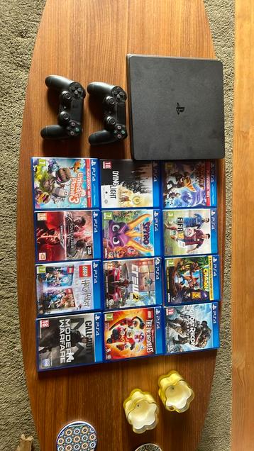 Playstation 4 slim + 2 controllers + 12 spellen beschikbaar voor biedingen