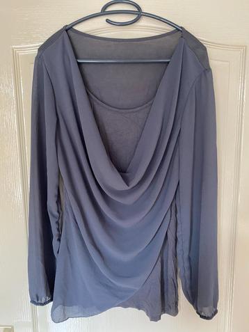 "Overslag" tuniek beschikbaar voor biedingen