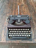 Antieke Triumph typemachine, Ophalen