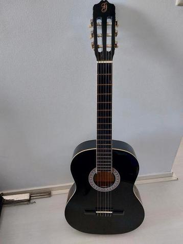 Gitaar zwart beschikbaar voor biedingen