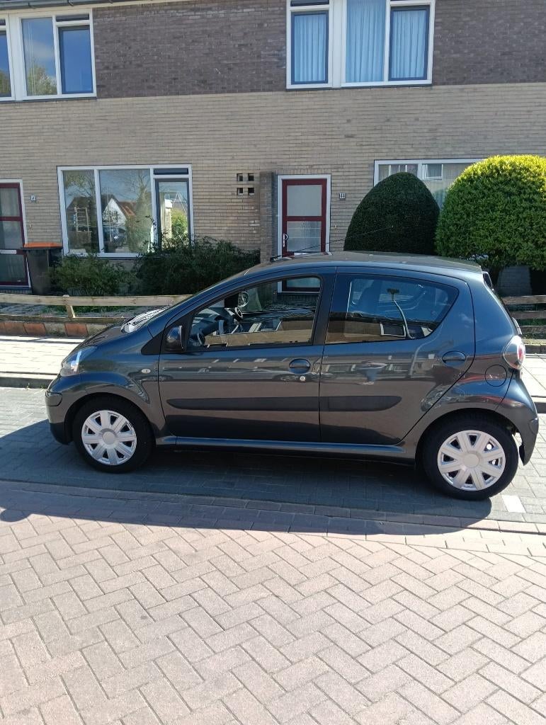 Toyota Aygo 1.0 12V Vvt-i 5DRS 2009 Grijs, Auto's, Toyota, Particulier, Aygo, Airbags, Centrale vergrendeling, Elektrische ramen