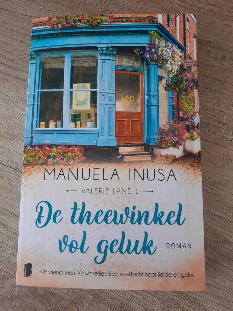 Boek De theewinkel vol geluk van Manuela Inusa., Ophalen of Verzenden, Zo goed als nieuw, Manuela Inusa