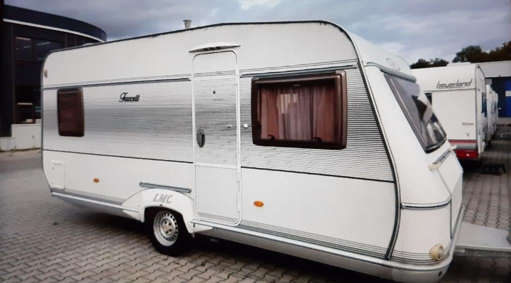 Caravan LMC Munsterland Favorit 490 P1. Bouwjaar 2006., Caravans en Kamperen, Rondzit, Frans bed, Particulier, Ringverwarming