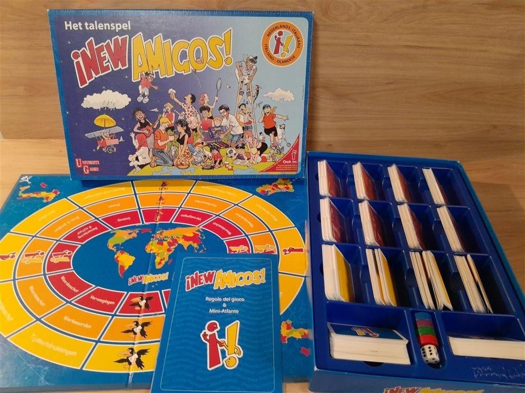 New Amigos - Het talenspel - Italiaans - Nederlands - s5885, Hobby en Vrije tijd, Gezelschapsspellen | Bordspellen, Ophalen of Verzenden