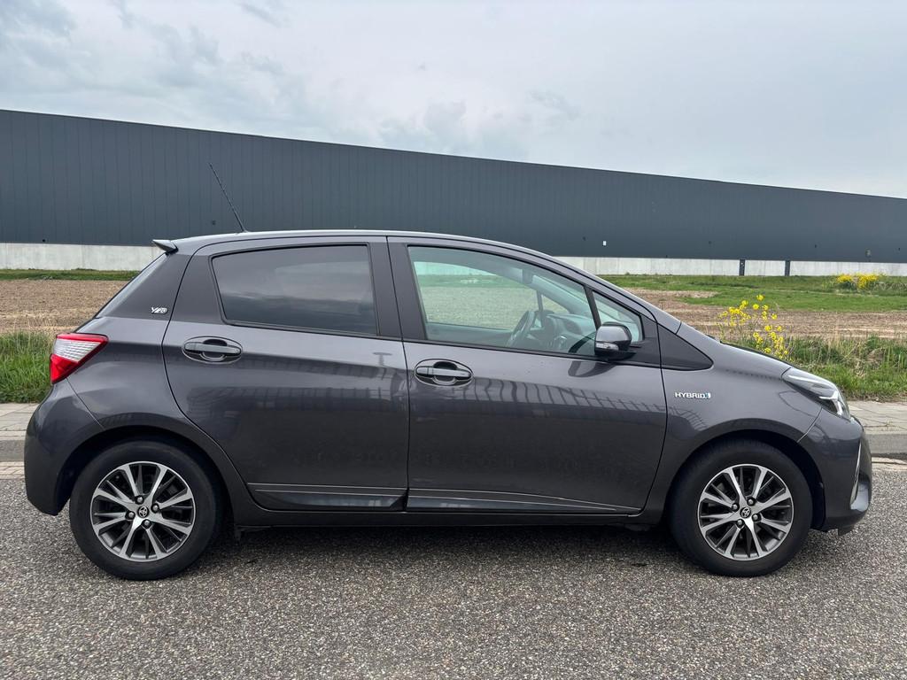 Toyota Yaris 1.5 Hybrid Y20 20 Jaren editie Automaat., Auto's, Euro 6, 4 cilinders, Lichtsensor, Origineel Nederlands