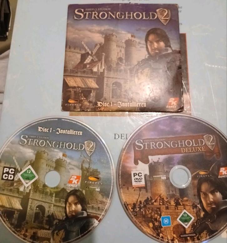 Stronghold 2 + DeLuxe PC Games - Firefly Studios, Spelcomputers en Games, Games | Sony PlayStation 3, Zo goed als nieuw, Strategie en Constructie